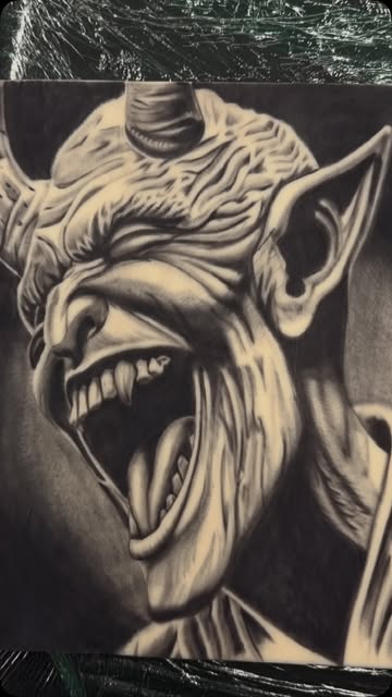 Pencil drawing of a screaming demon, the design stage